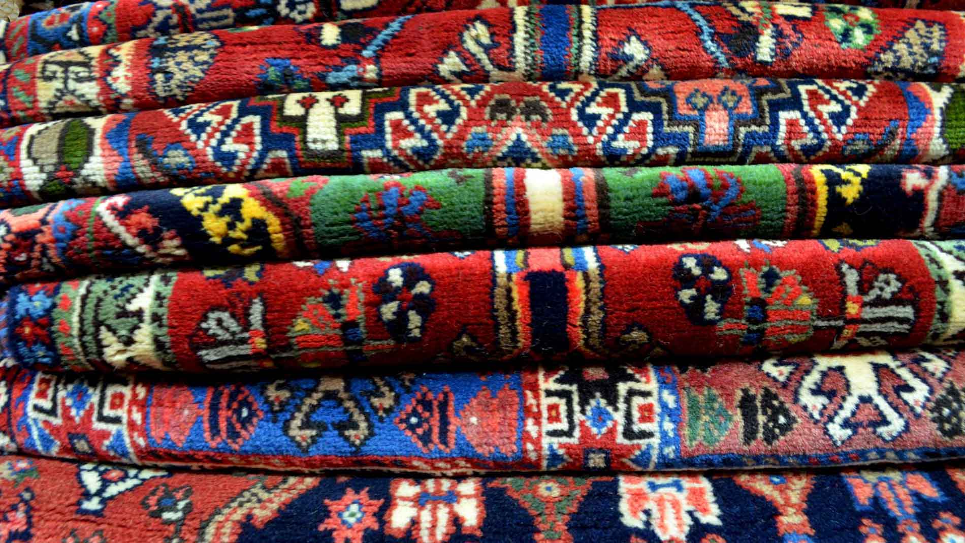 Stack of patterned area rugs